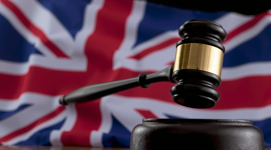 A stylized image of the UK flag with a subtle legal gavel overlay